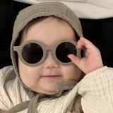 Baby wearing Teeny Baby Polarized Round Sunglasses With Strap