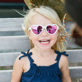 Girl Wearing white Teeny Baby Heart Polarized Sunglasses