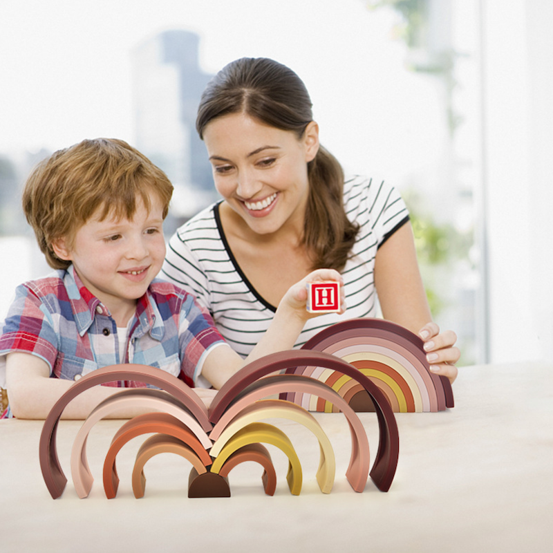 Mother Boy Child Playing With Montessori Silicone Rainbow Stacking Toy
